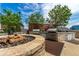 Rooftop outdoor kitchen features stone accents, stainless steel appliances, and a cozy fire pit at 1700 Bassett St # 1102, Denver, CO 80202