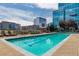 Rooftop swimming pool with lounge chairs and city views at 1700 Bassett St # 1102, Denver, CO 80202