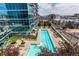 Aerial view of a sparkling swimming pool with surrounding lounge chairs at 1700 Bassett St # 1102, Denver, CO 80202
