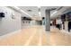 Bright yoga studio with hardwood floors, mirrors, and organized storage for equipment at 1700 Bassett St # 1102, Denver, CO 80202