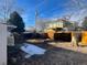 View of the backyard featuring a partial fence and the back of the home at 4445 E Florida Ave, Denver, CO 80222