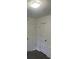 A bedroom showcasing two doorways and a freshly painted interior with ample natural light at 4445 E Florida Ave, Denver, CO 80222