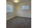 Bright bedroom featuring neutral walls and plush gray carpeting for a cozy atmosphere at 4445 E Florida Ave, Denver, CO 80222