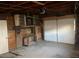 Spacious garage area with unfinished walls and concrete flooring ready for custom build-out at 4445 E Florida Ave, Denver, CO 80222