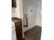 This updated kitchen features dark lower cabinets and modern white uppers and a small window at 4445 E Florida Ave, Denver, CO 80222