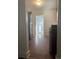 Traditional kitchen features white cabinets, stainless steel refrigerator, and wood-look floors at 4445 E Florida Ave, Denver, CO 80222