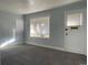 Well lit living room featuring freshly painted walls and carpeted floors at 4445 E Florida Ave, Denver, CO 80222