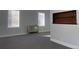 Carpeted living room with gray walls, heater, and display nook at 4445 E Florida Ave, Denver, CO 80222