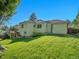 Spacious backyard with a lush lawn, minimal landscaping, and the home's exterior at 6844 S Detroit Cir, Centennial, CO 80122