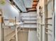 Unfinished basement space with exposed utilities and shelving units, offering potential for customization at 6844 S Detroit Cir, Centennial, CO 80122