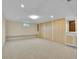 Spacious basement area with ample closet storage and natural light, offering versatility at 6844 S Detroit Cir, Centennial, CO 80122