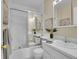 Clean, white bathroom with shower-tub combination and ample vanity space, offering a pristine feel at 6844 S Detroit Cir, Centennial, CO 80122
