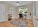 Office space that is sun-filled and showcases a wooden floor, rug, and windows with views of nature at 6844 S Detroit Cir, Centennial, CO 80122