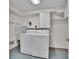 Functional laundry room equipped with washer, dryer, sink, and storage, making chores convenient at 6844 S Detroit Cir, Centennial, CO 80122