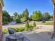 Picturesque neighborhood street view showcasing the lush trees and beautiful homes on a sunny day at 6844 S Detroit Cir, Centennial, CO 80122