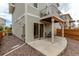 The back exterior view shows a balcony with patio and fenced garden area at 10102 Yampa Ct, Commerce City, CO 80022