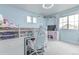 Bright bedroom featuring a built-in lofted bed, work space, and shelving at 10102 Yampa Ct, Commerce City, CO 80022
