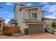 Exterior of home with attached garage, hardiplank siding and a small balcony at 10102 Yampa Ct, Commerce City, CO 80022