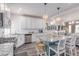 Bright kitchen featuring an island with seating and stainless steel appliances at 10102 Yampa Ct, Commerce City, CO 80022