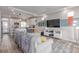 Open living area flowing into the kitchen with modern decor and recessed lighting at 10102 Yampa Ct, Commerce City, CO 80022