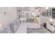 Comfortable living area connected to the kitchen, perfect for entertaining and relaxation at 10102 Yampa Ct, Commerce City, CO 80022