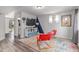 Cozy living room with colorful rug, stylish chairs, and entertainment center at 10102 Yampa Ct, Commerce City, CO 80022