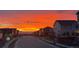 Street view showcases a beautiful sunrise in a residential neighborhood at 10102 Yampa Ct, Commerce City, CO 80022