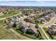Beautiful aerial view of a suburban neighborhood with well-maintained homes and tree-lined streets at 11181 W Crestline Dr, Littleton, CO 80127