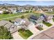 Aerial view of the neighborhood with mountain views, green spaces, and residential homes at 11181 W Crestline Dr, Littleton, CO 80127