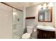 Updated bathroom features shower with glass doors, modern lighting and fixtures at 11181 W Crestline Dr, Littleton, CO 80127