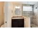 Bathroom featuring granite countertop, dark cabinets and glass enclosed tiled shower at 11181 W Crestline Dr, Littleton, CO 80127