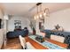 Open-concept design seamlessly blends the dining area with the living room and kitchen at 11181 W Crestline Dr, Littleton, CO 80127