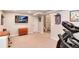 Exercise room with TV, treadmill, weights, and space to exercise at 11181 W Crestline Dr, Littleton, CO 80127