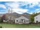The houses has mountain views, mature trees, backyard, and wooden fence at 11181 W Crestline Dr, Littleton, CO 80127