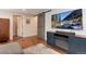 Living room features hardwood floors, flat screen TV, and a stylish barn door at 11181 W Crestline Dr, Littleton, CO 80127