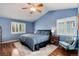 Comfortable main bedroom features vaulted ceiling, plush bedding, and natural light at 11181 W Crestline Dr, Littleton, CO 80127