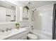 Clean bathroom featuring shower-tub combo and a stylish vanity with modern fixtures at 12470 E Cornell Ave # 104, Aurora, CO 80014