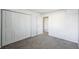 Bright bedroom featuring double door closet and gray walls at 12470 E Cornell Ave # 104, Aurora, CO 80014