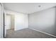 Spacious bedroom with gray walls and carpeted floor at 12470 E Cornell Ave # 104, Aurora, CO 80014