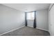 Simple bedroom with gray walls and carpeted floor at 12470 E Cornell Ave # 104, Aurora, CO 80014