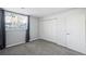 Bright bedroom with gray carpet and double closets at 12470 E Cornell Ave # 104, Aurora, CO 80014