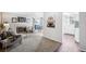 Cozy living room featuring a fireplace, plush seating, and slider door to the outside at 12470 E Cornell Ave # 104, Aurora, CO 80014