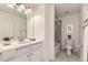 Well-lit bathroom featuring a vanity, large mirror, and a shower/tub combo at 2616 Loon Cir, Castle Rock, CO 80104