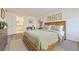 Comfortable bedroom featuring a wood-frame bed, decorative pictures, and a small desk at 2616 Loon Cir, Castle Rock, CO 80104