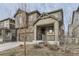 Attractive home featuring stone accents and a welcoming covered front porch, complemented by a neatly landscaped yard at 2616 Loon Cir, Castle Rock, CO 80104