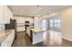 Bright kitchen with island, granite countertops, pendant lights, and stainless appliances at 2616 Loon Cir, Castle Rock, CO 80104