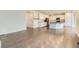 Open-concept kitchen with island, pendant lights, and stainless steel refrigerator at 2616 Loon Cir, Castle Rock, CO 80104
