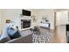 Comfortable living room with hardwood floors, a fireplace, and tasteful decor, perfect for relaxation and entertaining at 2616 Loon Cir, Castle Rock, CO 80104