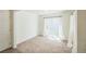 Inviting bedroom with great light, soft carpet, and direct access to the backyard at 18211 E 51St Ave, Denver, CO 80249