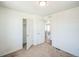 Comfortable bedroom featuring neutral walls and carpet, with closet and easy hall access at 18211 E 51St Ave, Denver, CO 80249